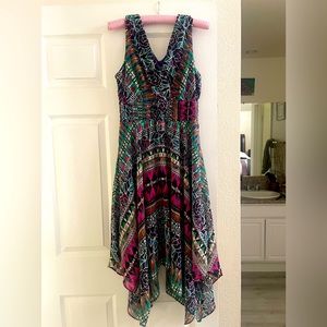 Beautiful, asymmetrical rich floral pattern dress.